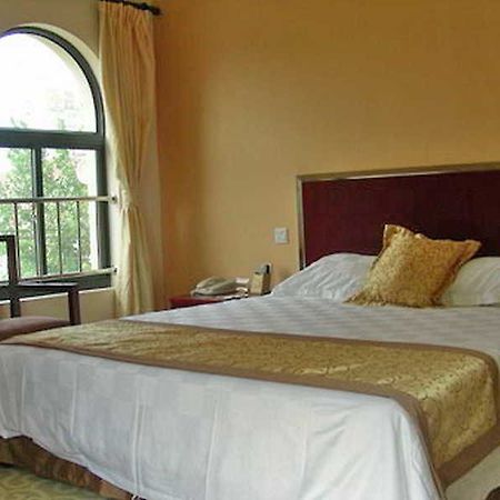 Regius Exhibition Hotel Xangai Quarto foto